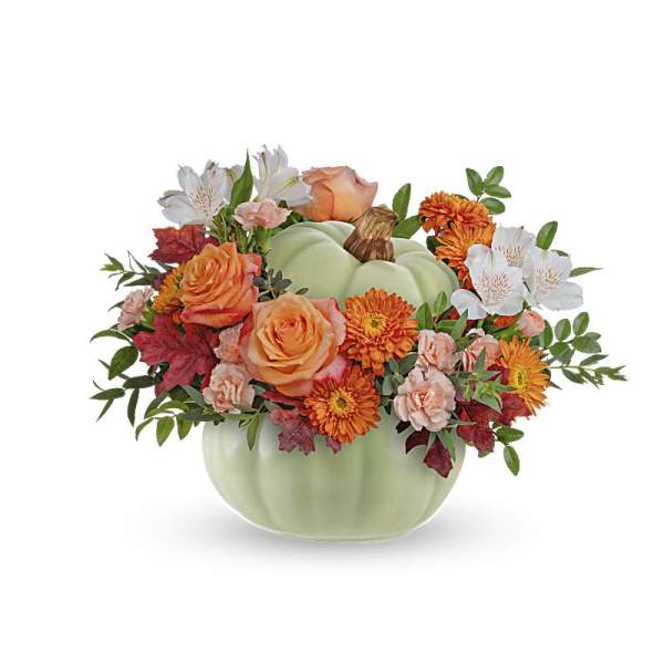 Pumpkin-shaped vase with orange and white flowers