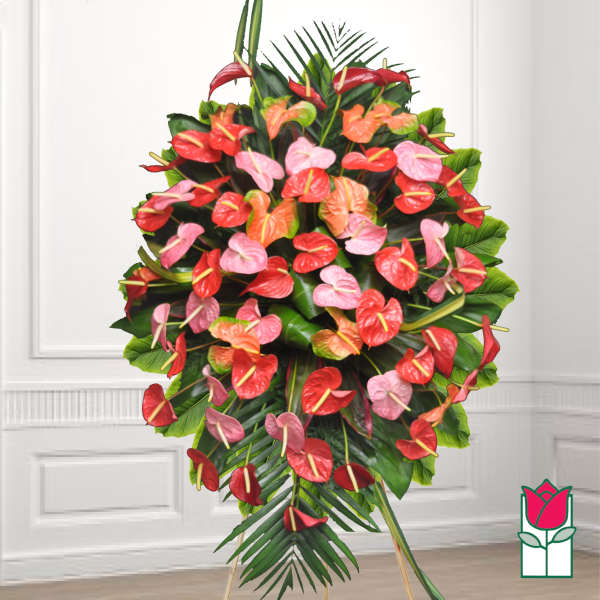 Standing floral spray with red, pink, and orange anthuriums