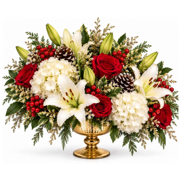 Red roses and white lilies in a gold pedestal vase with berries and pinecones