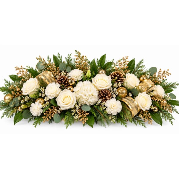 White roses and carnations in a long low arrangement with gold accents
