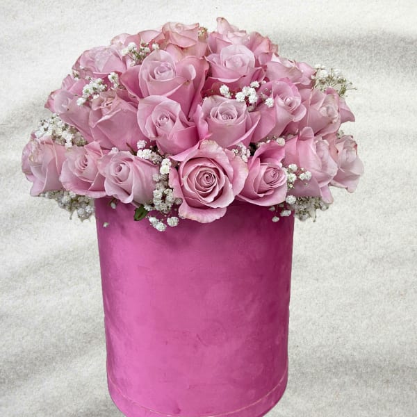 Pink roses with baby's breath in a tall pink box