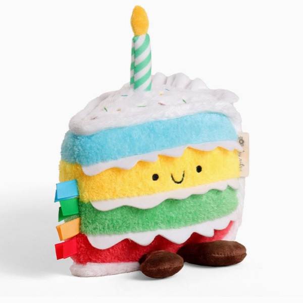 Plush slice of cake with a striped candle on top