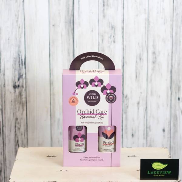 Pink orchid care kit box with two bottles in a windowed package