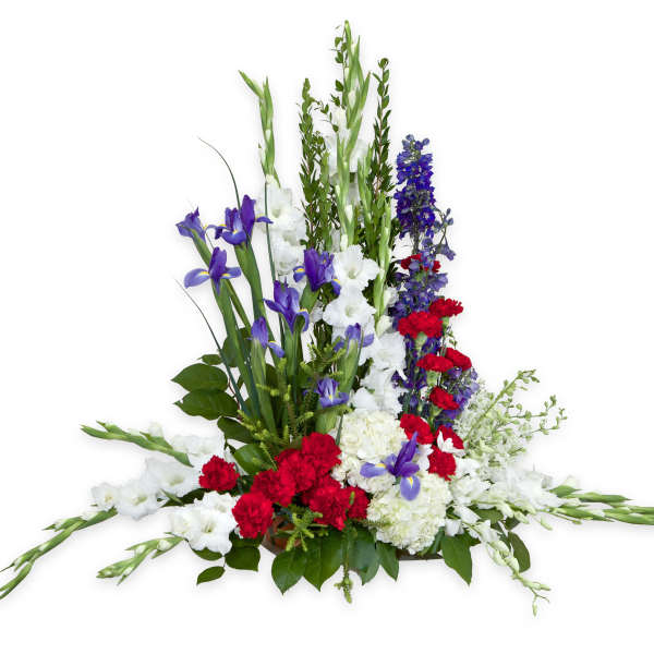 Tall floral arrangement with white, purple, and red flowers