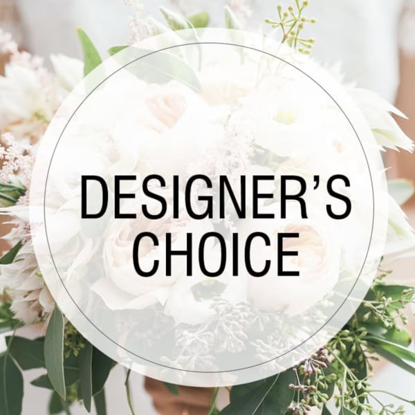 White floral arrangement with mixed blooms and greenery, overlaid with "DESIGNER'S CHOICE" text
