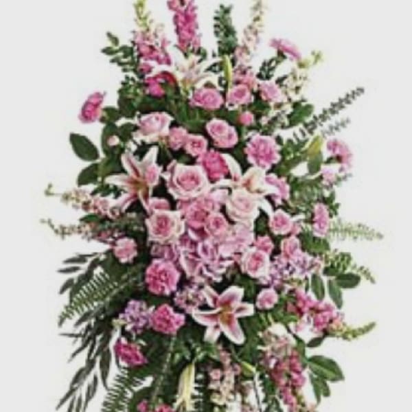 Tall pink floral standing spray on an easel