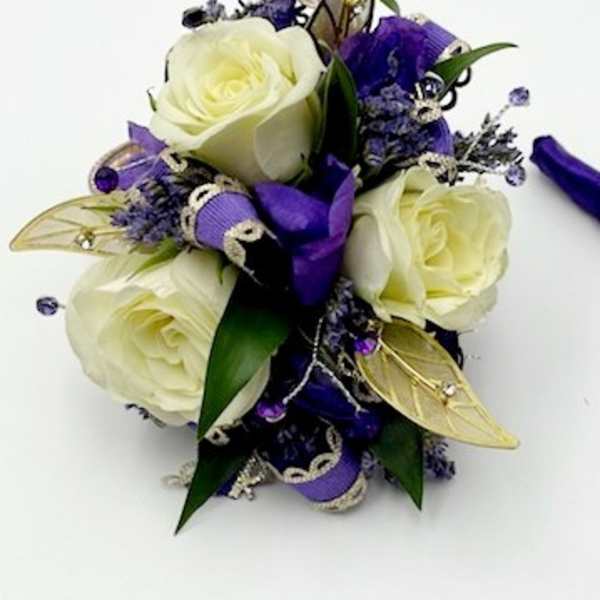 White rose bouquet with purple ribbon and gold butterfly accents