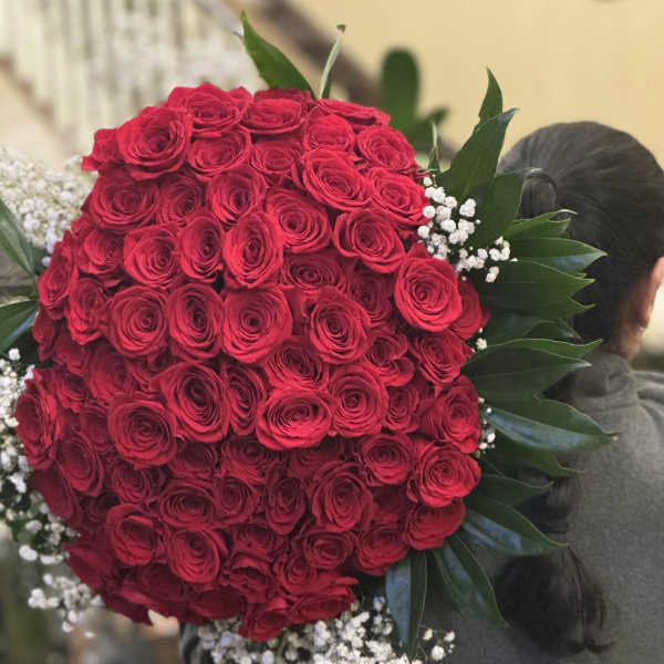 Large bouquet of red roses with white baby's breath