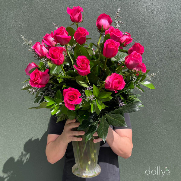 Bouquet of hot pink roses in a clear glass vase