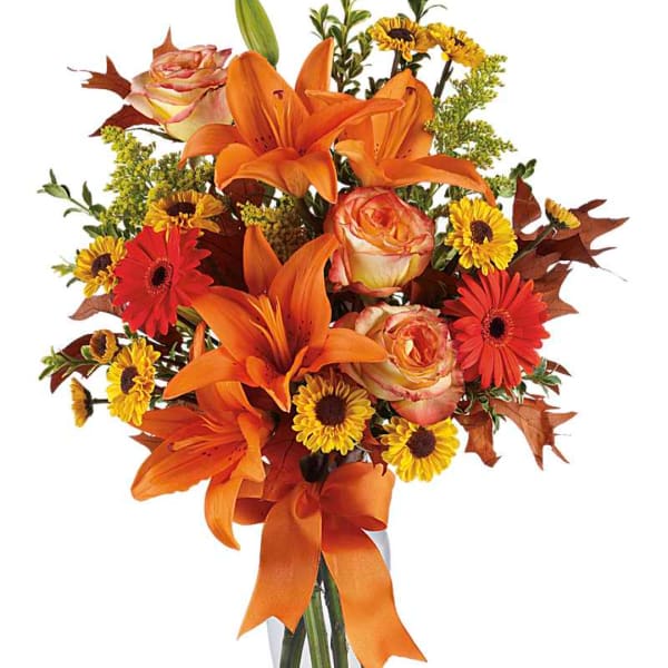 Orange lilies and roses with yellow daisies in a ribbon-tied bouquet