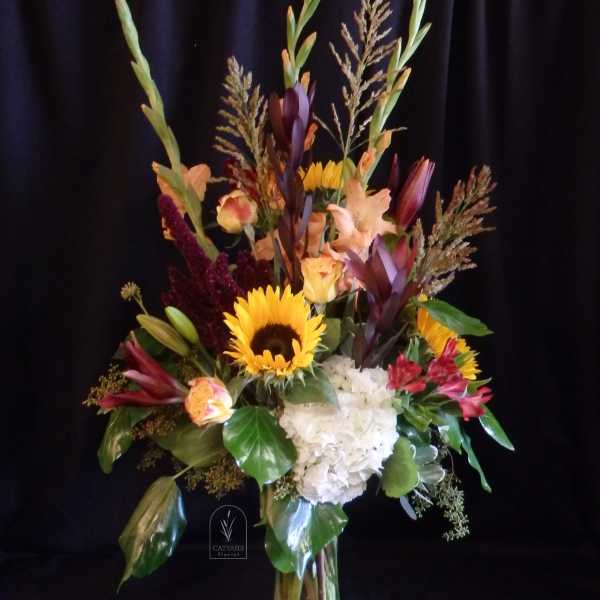 Tall bouquet with sunflowers, white hydrangea, and mixed tropical blooms