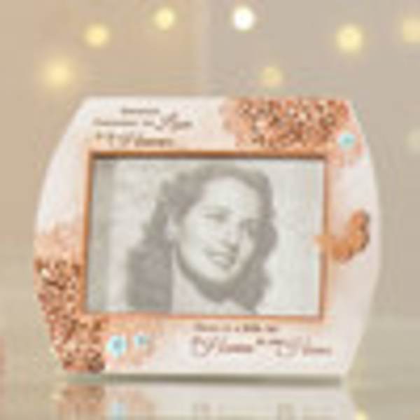Framed memorial portrait with floral accents and text