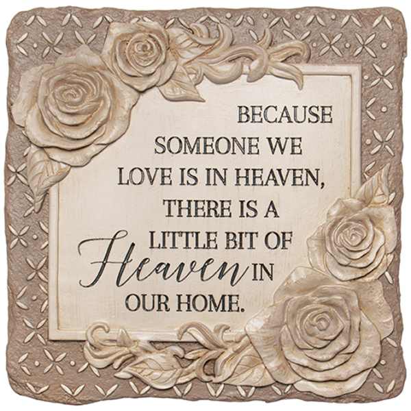 Decorative memorial plaque with carved roses and a sympathy quote