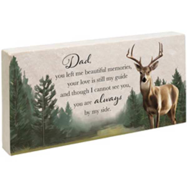 Memorial plaque with a deer and forest scene and a message for Dad