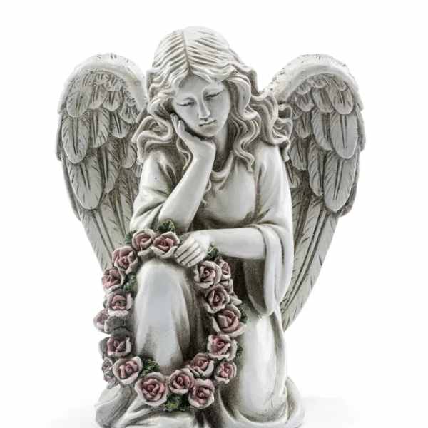 Stone angel figurine holding a pink rose wreath