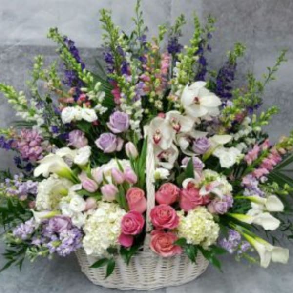 Large mixed flower basket with pink, white, and purple blooms