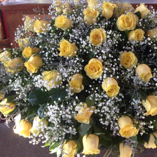 Large bouquet of yellow roses with white baby's breath