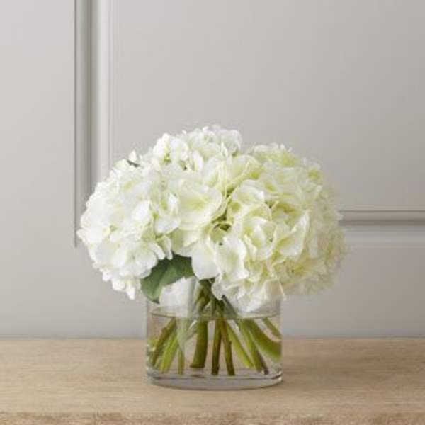 White hydrangea bouquet in a clear glass vase