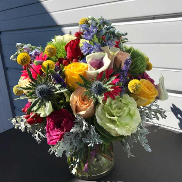 Colorful mixed bouquet in a clear glass vase