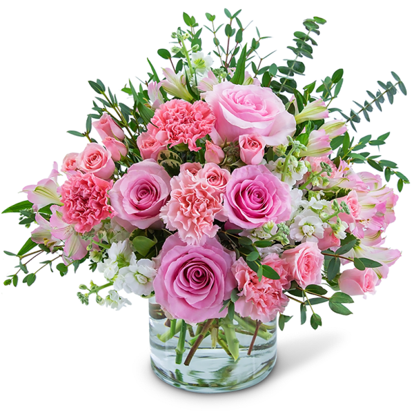 Pink roses and carnations in a clear glass vase