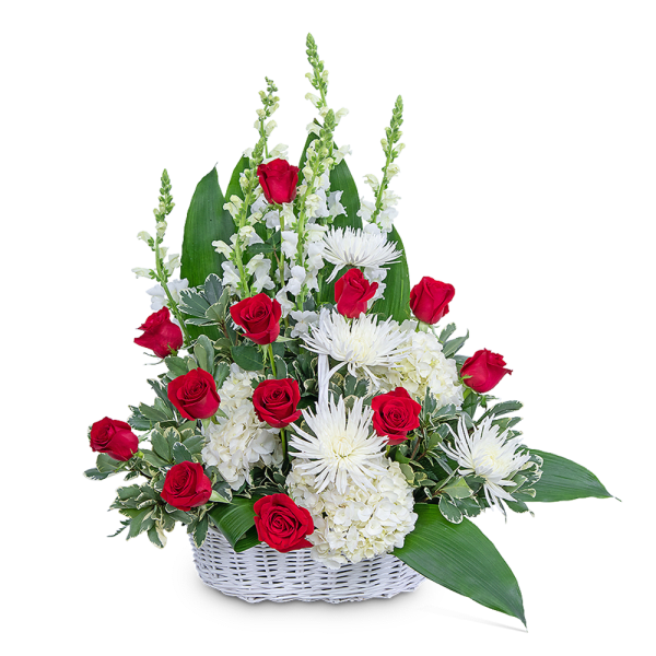 Red roses and white flowers in a white basket