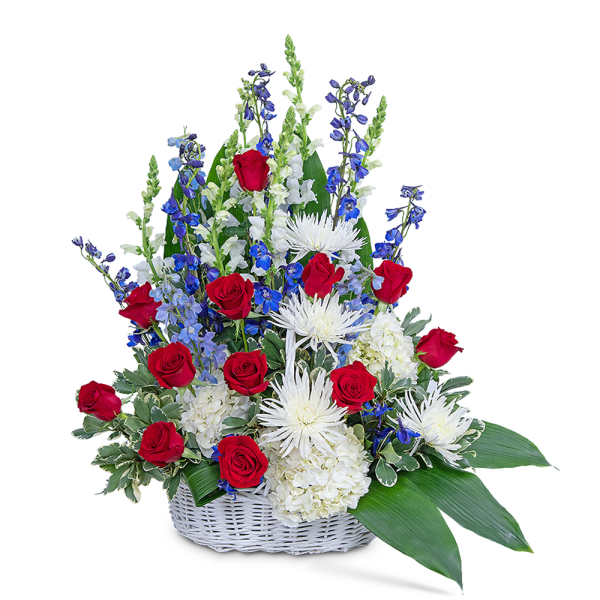 Basket arrangement of red roses, white blooms, and blue flowers