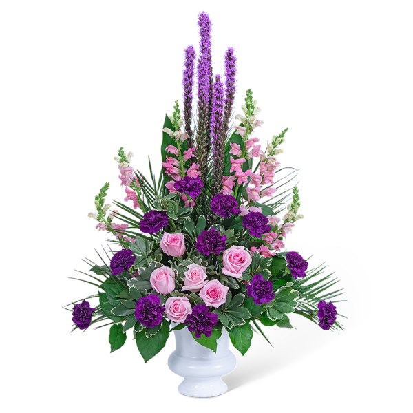 Pink roses and purple flowers arranged in a white vase