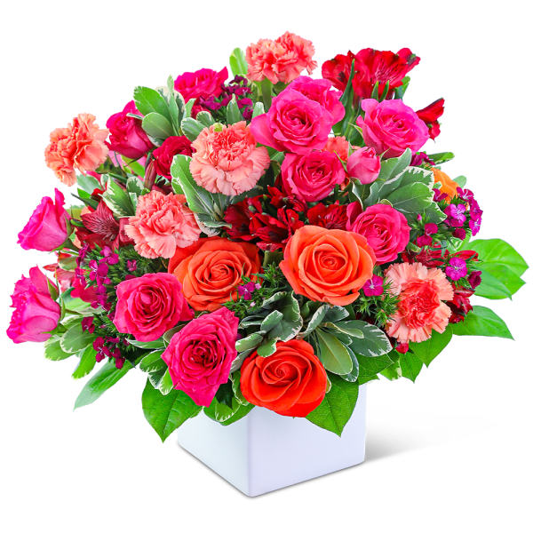Mixed pink and orange roses with carnations in a white vase