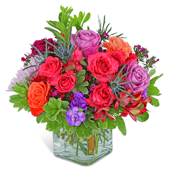 Colorful mixed bouquet in a clear square vase