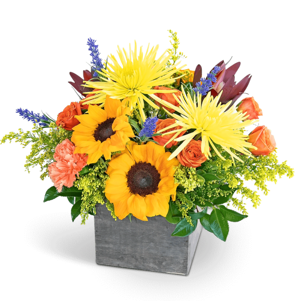 Bouquet of sunflowers and orange roses in a gray square vase