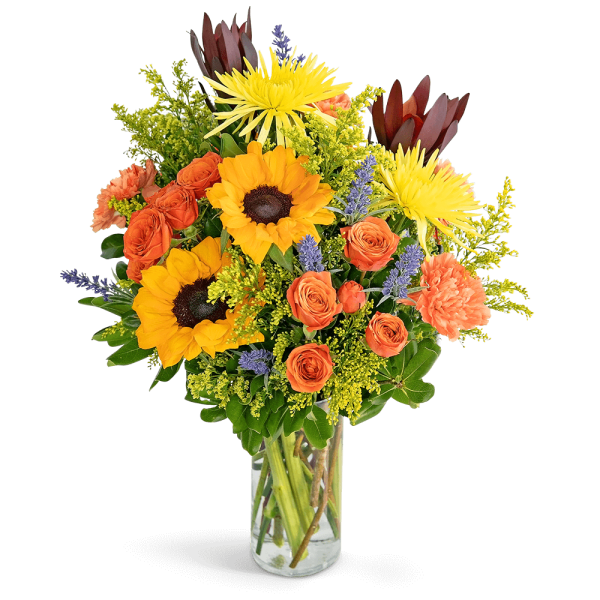Mixed bouquet of sunflowers, orange roses, and a clear glass vase