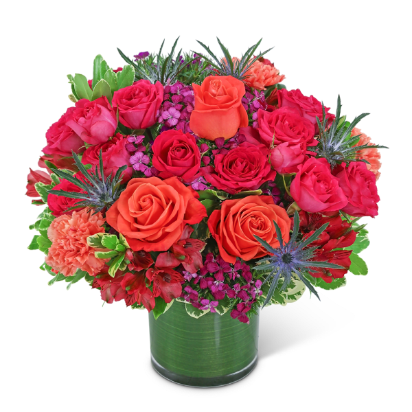 Bouquet of pink and orange roses in a glass vase