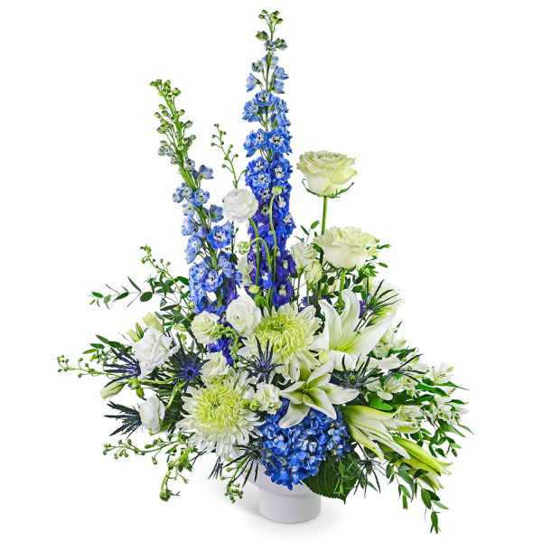 White and blue floral arrangement in a white vase