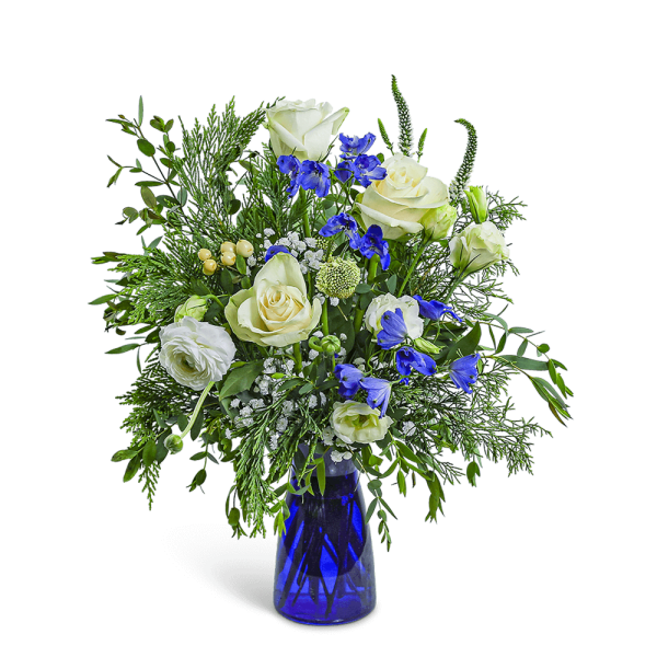 White roses and blue flowers in a blue glass vase