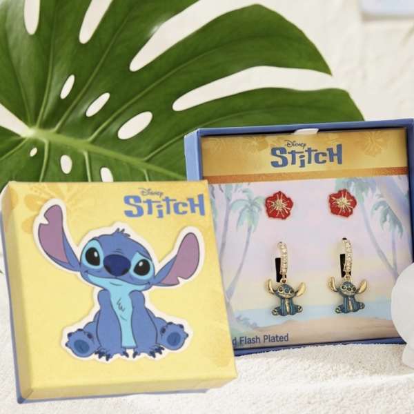 White orchid beside Stitch-themed jewelry boxes