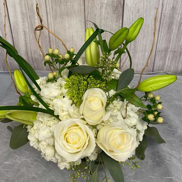 White rose and hydrangea bouquet with green lily buds