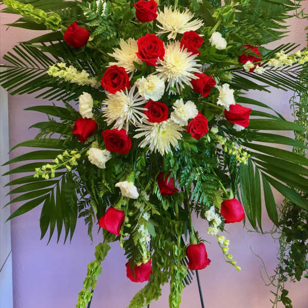 Tall floral spray with red roses and white spider mums