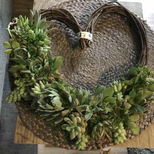 Succulent wreath on a woven straw base
