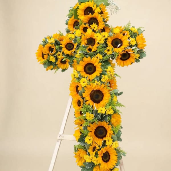 Cross-shaped sunflower arrangement with yellow filler flowers
