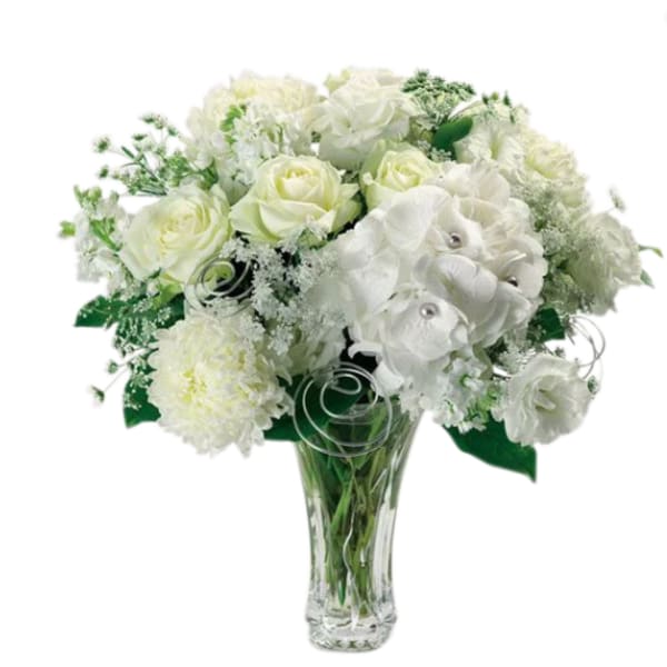 White floral bouquet in a clear glass vase