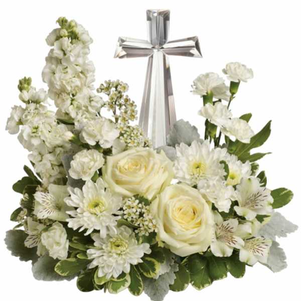 White floral arrangement with a silver cross centerpiece