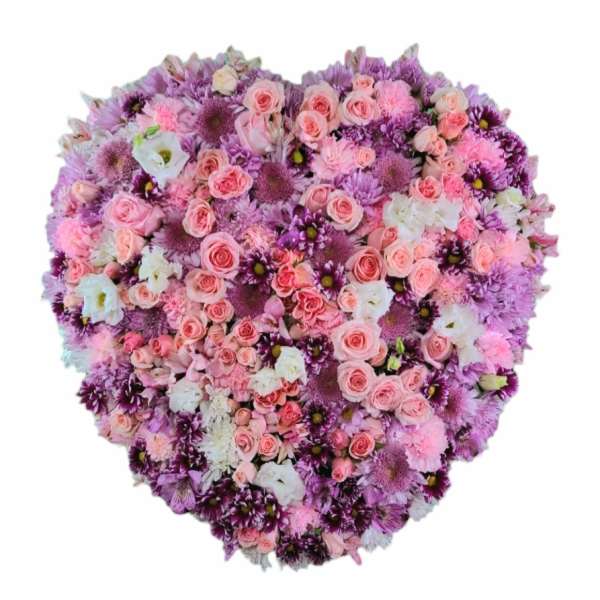 Heart-shaped bouquet of pink, purple, and white flowers