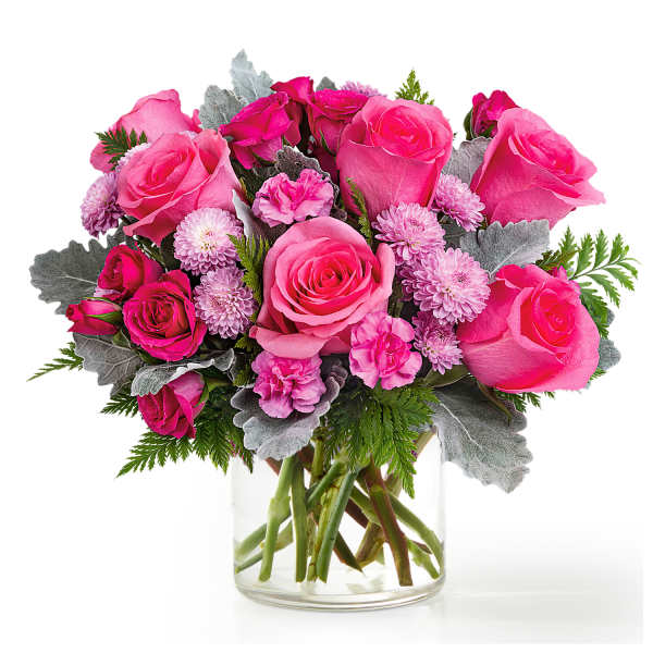 Pink roses and small lavender flowers in a clear glass vase