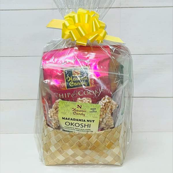 Gift basket of Hawaiian snacks wrapped in clear cellophane with a yellow bow