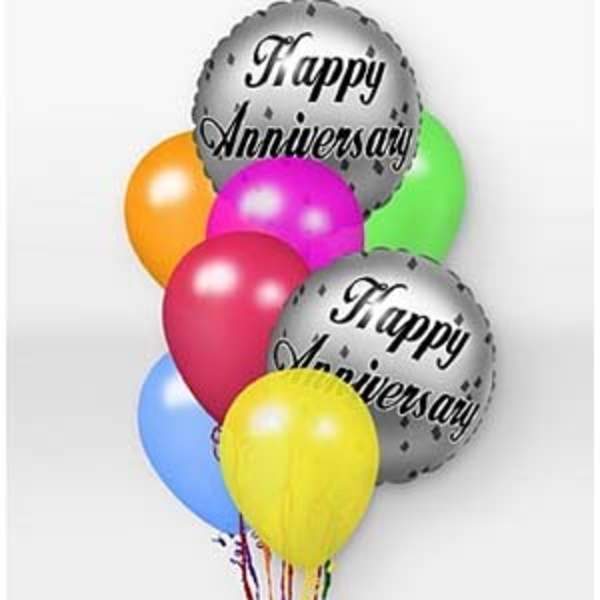 Cluster of colorful balloons with two silver "Happy Anniversary" balloons