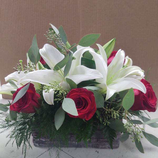 Wood grain box of red & white flowers