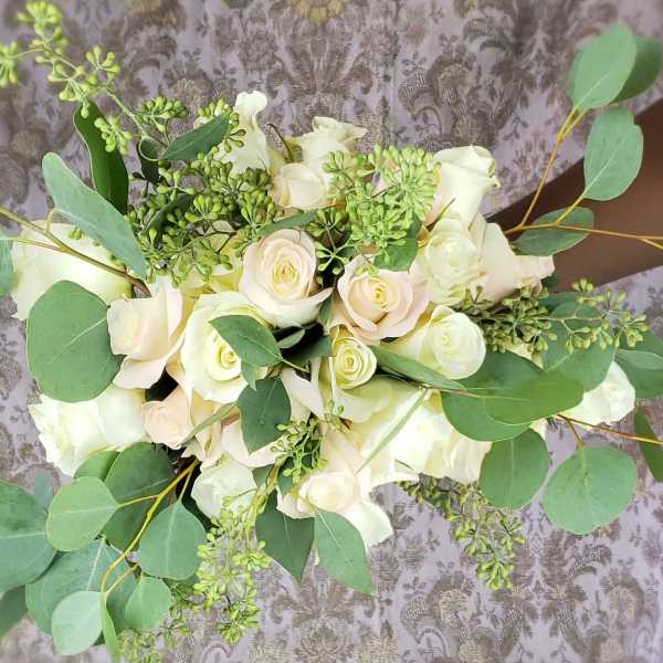 Bouquet of white roses with eucalyptus greenery