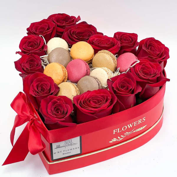 Heart-shaped box of red roses with assorted macarons