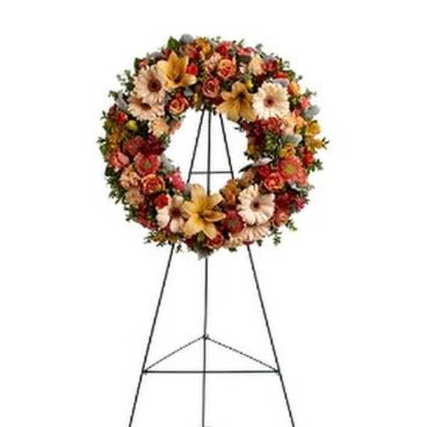 Floral wreath on a metal easel stand