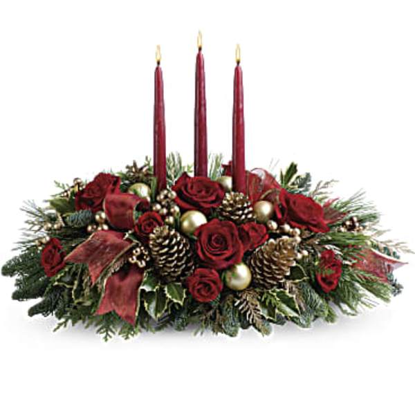 Holiday centerpiece with red roses and three burgundy candles
